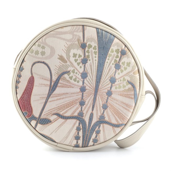 Round handbag made of elegant art nouveau fabric, combined with cream-coloured leather.