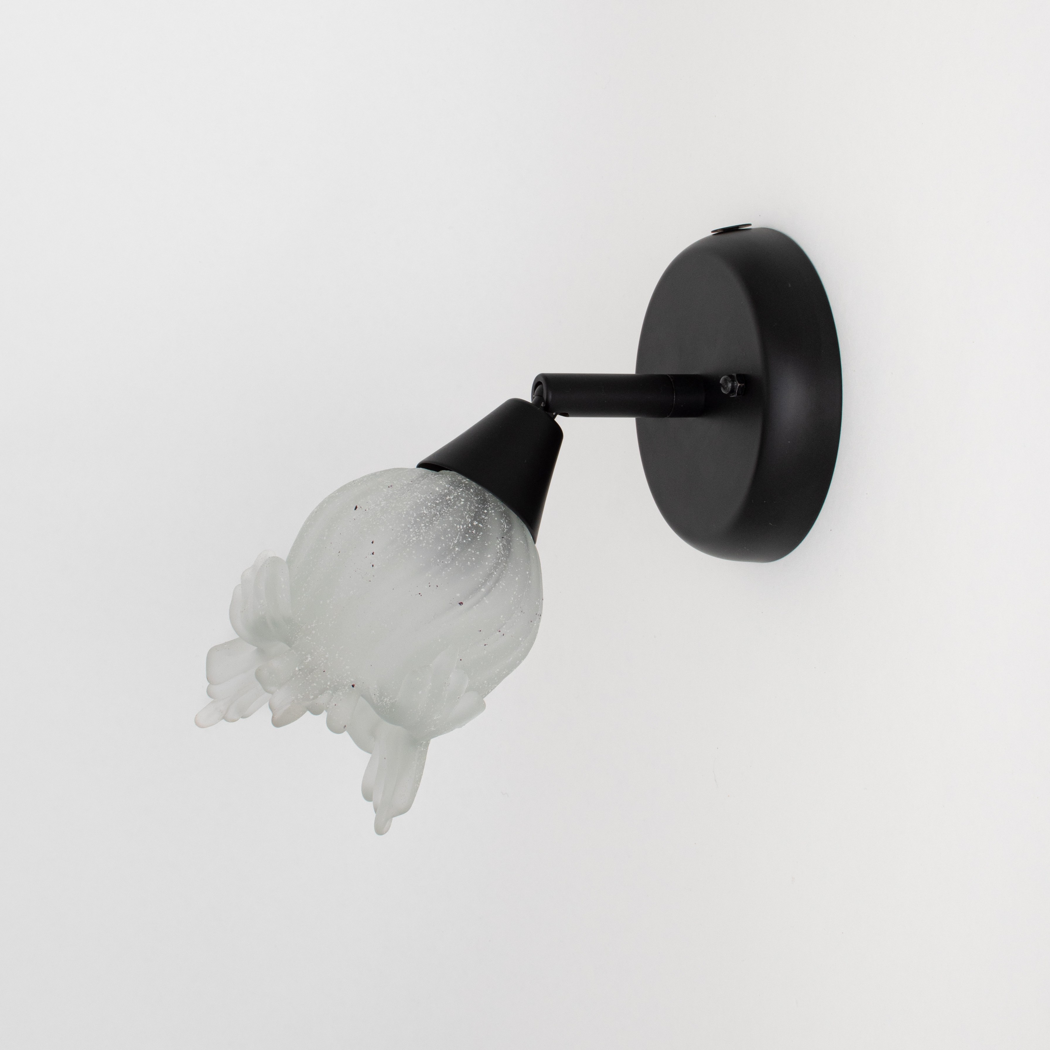 Black wall spotlight with floral glass shade