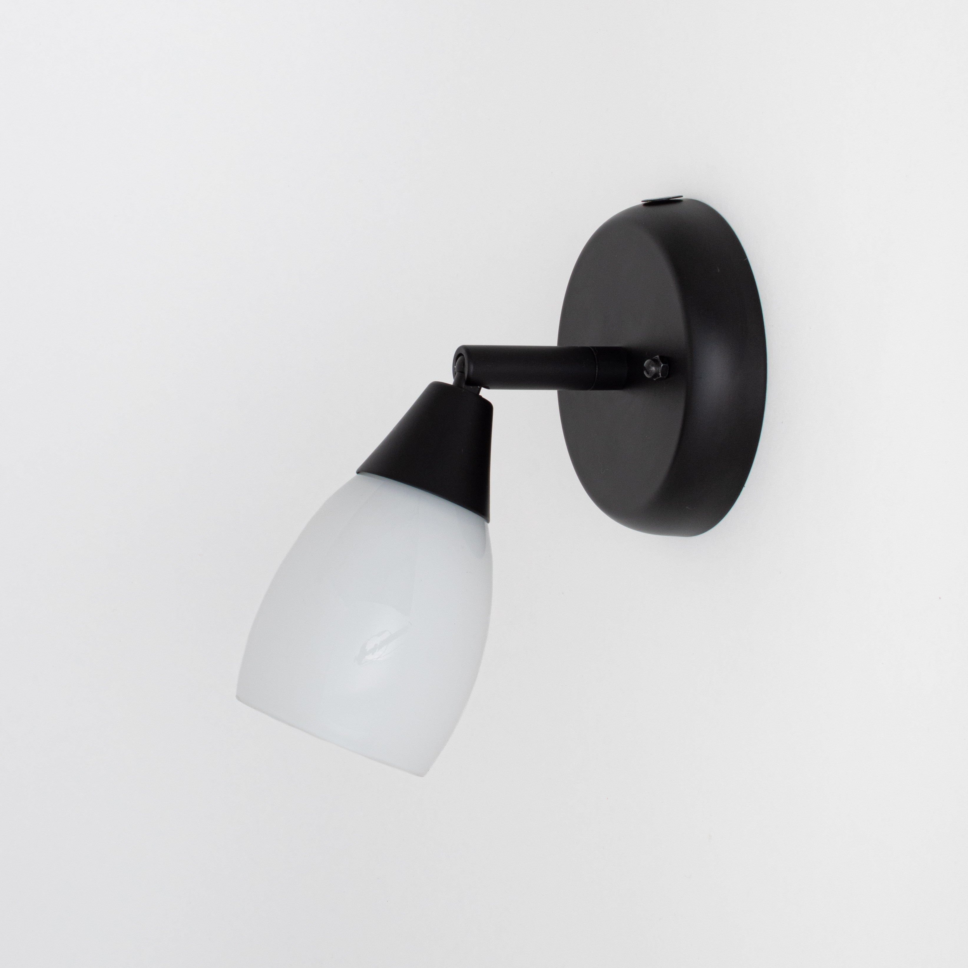 Black wall spotlight with opal white glass shade