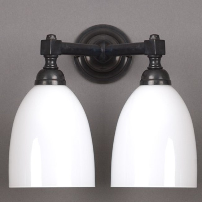 Bathroom wall lamp V-shaped with opal white glass shade and bronze finish